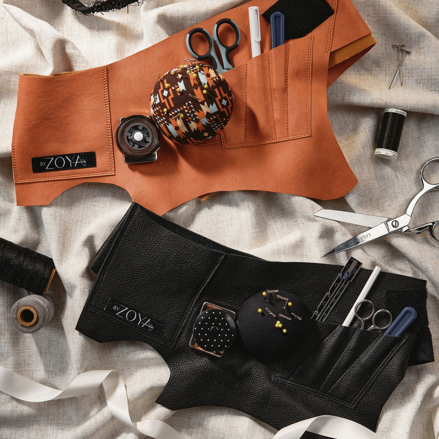 Picture of two Fashion's toolbelt in black vegan leather and copper leather