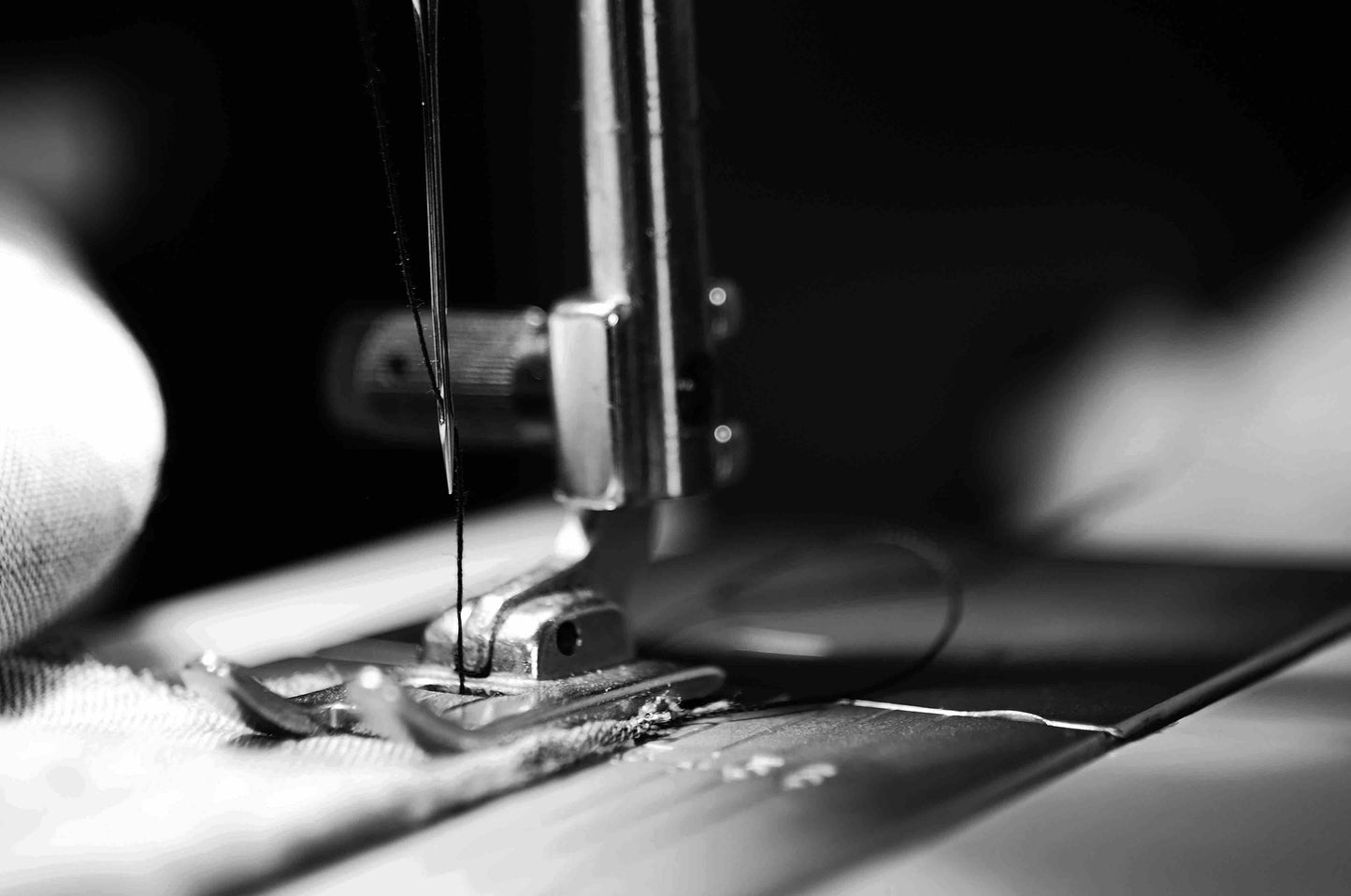 Black & white picture of close up sewing machine